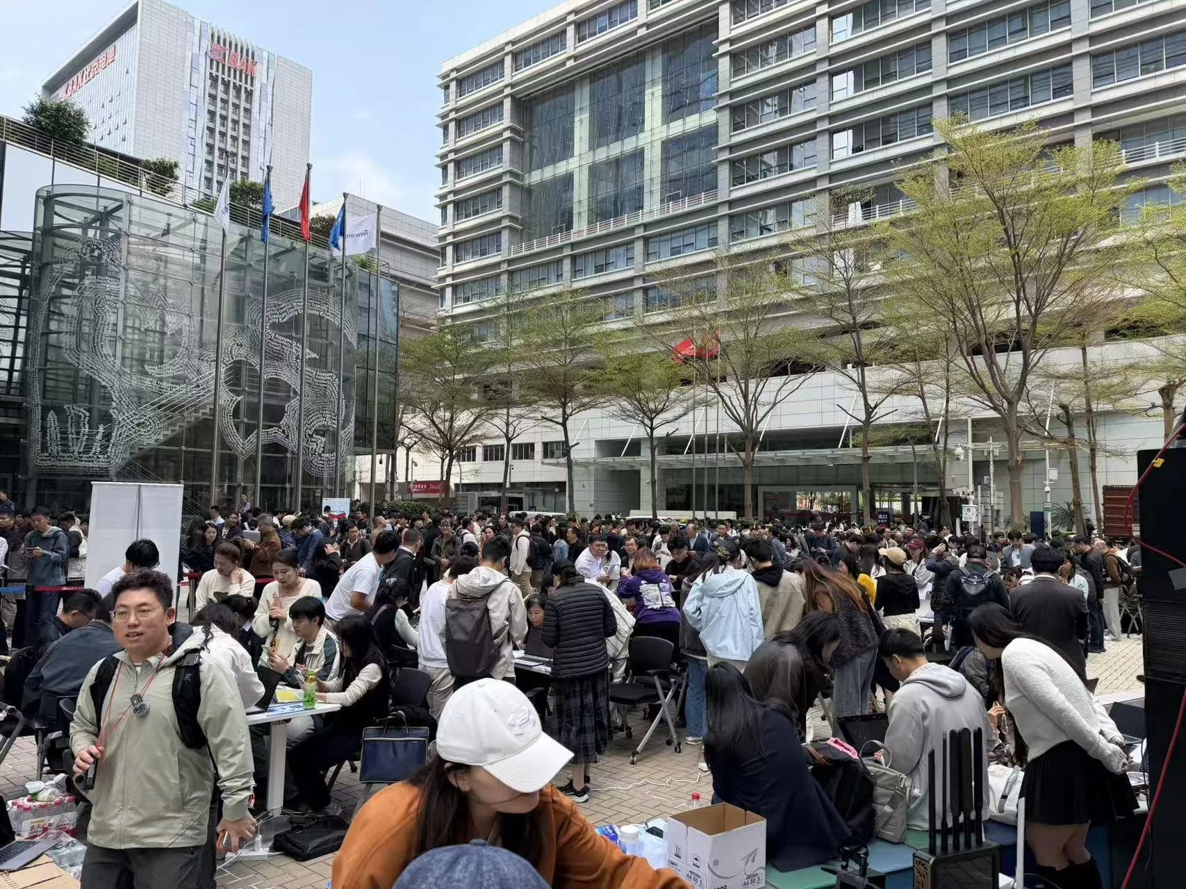 Over 1,000 people line up outside Tencent headquarters in Shenzhen for help installing OpenClaw
